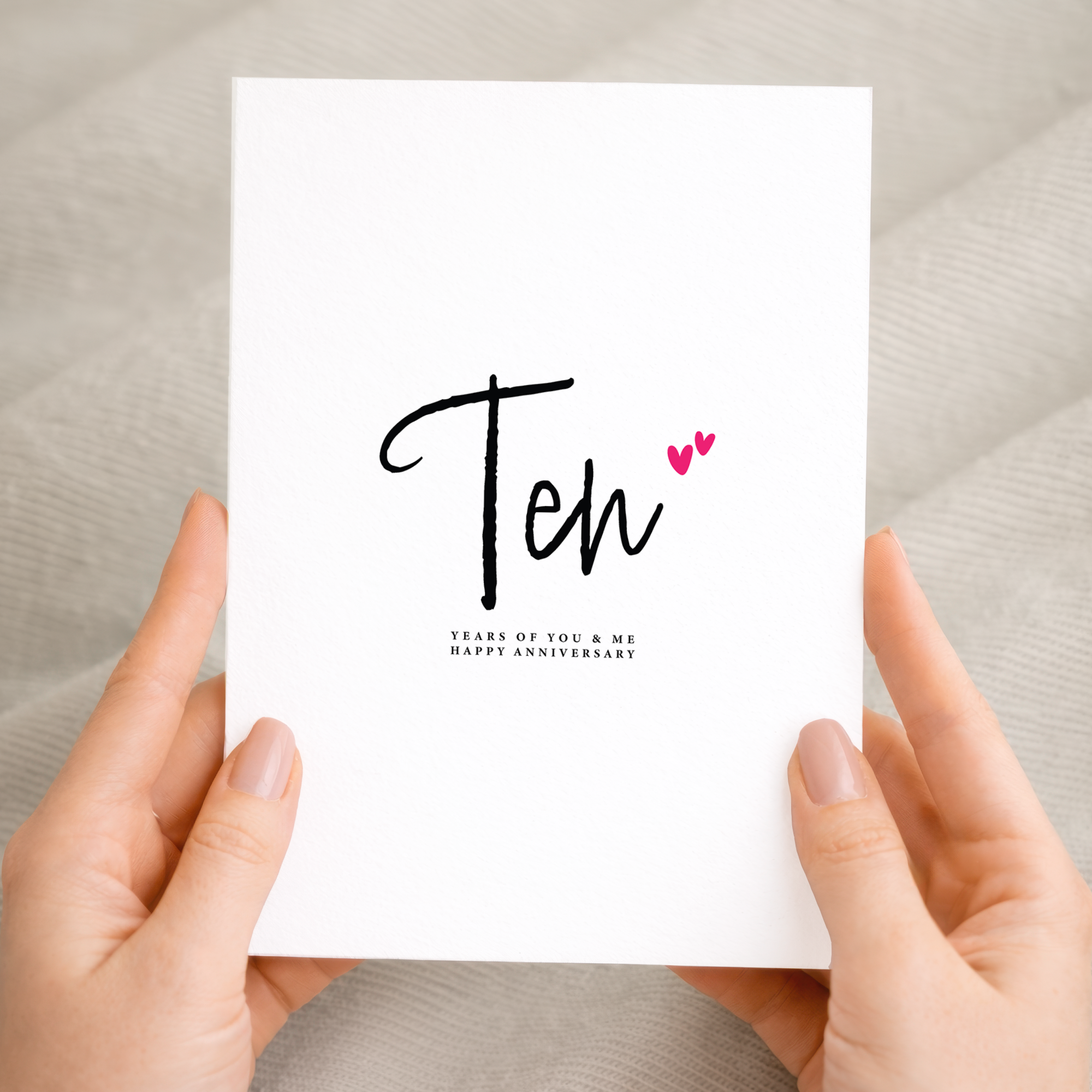 A romantic Ten Year Anniversary greeting card for a partner featuring a clean letters and numbers design on a white background.