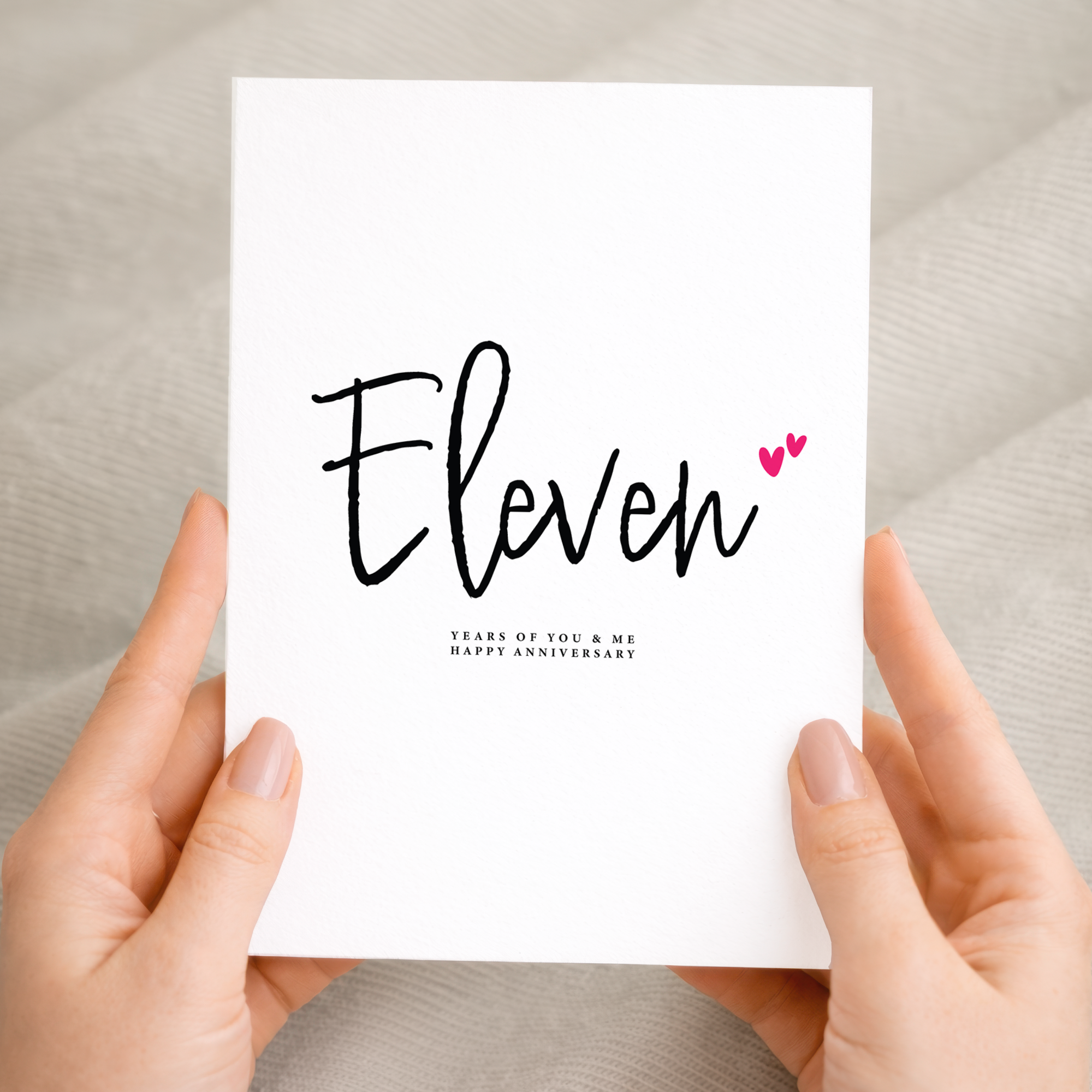 An elegant 11th Wedding Anniversary greeting card featuring a modern letters and numbers design on a white background.