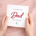 A Christmas greeting card for Dad featuring a festive design with letters and numbers on a clean background.