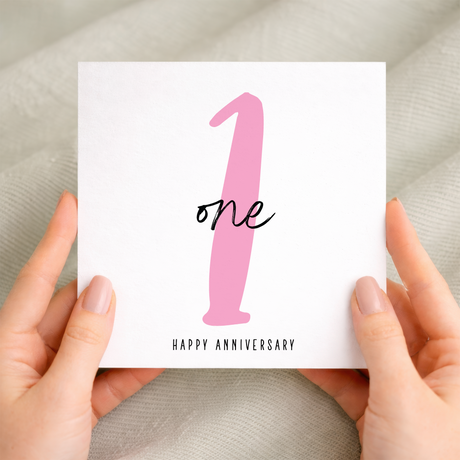 A simple and elegant 1st wedding anniversary greeting card featuring a charming design for a wife or husband on a white background.