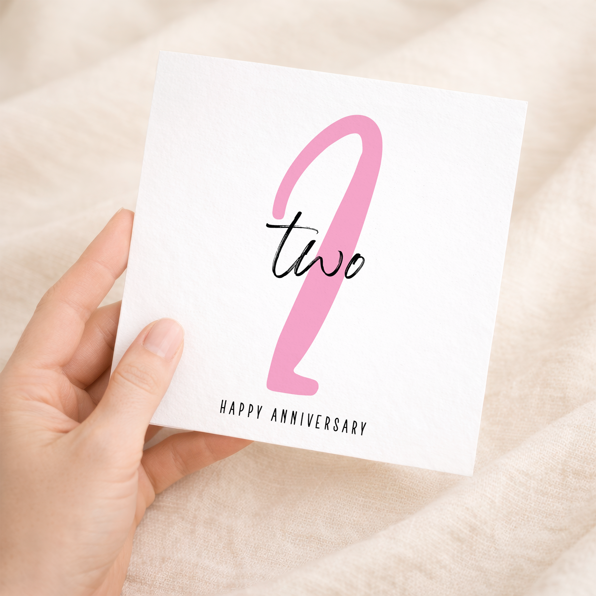 A simple and elegant 2nd wedding anniversary greeting card for him or her featuring a stylish numeric design on a white background.