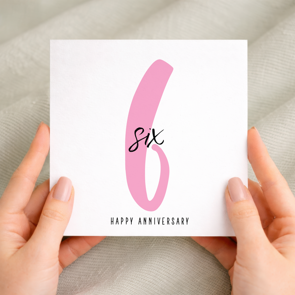 A 6th wedding anniversary greeting card featuring a simple design with the number 6 on a textured, eco-friendly recycled card.