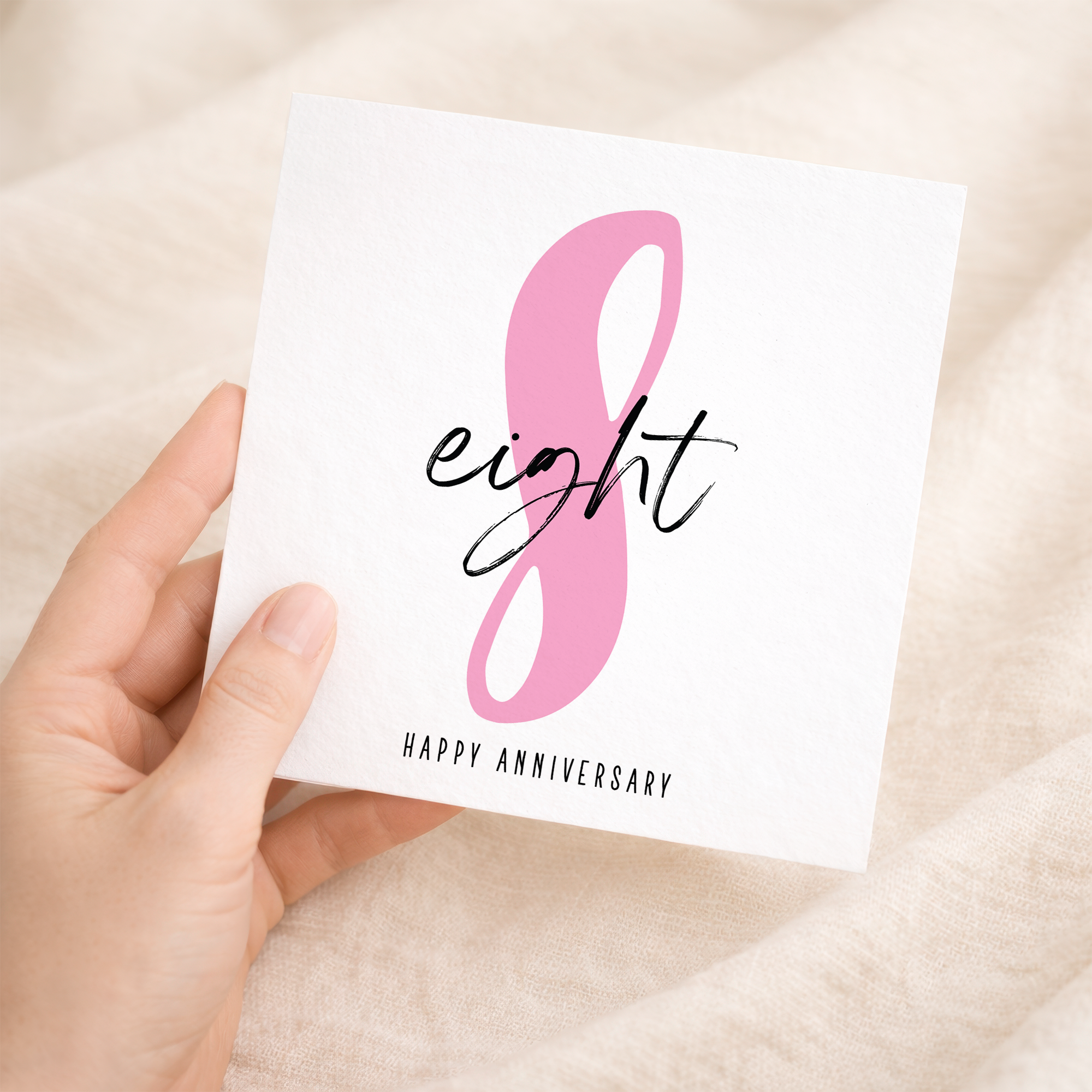 An 8th wedding anniversary greeting card featuring a simple and elegant design with the number 8 on a white background.