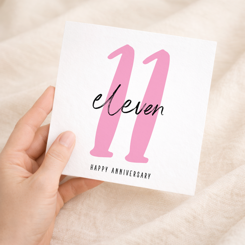 A simple 11th wedding anniversary greeting card for him or her featuring a minimalist design on a white background.