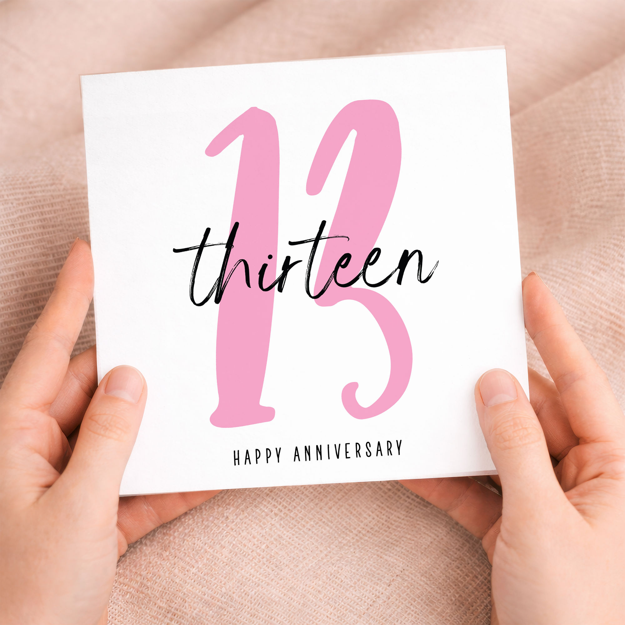 A simple and elegant 13th wedding anniversary greeting card for a husband or wife featuring a letters and numbers design on a white background.