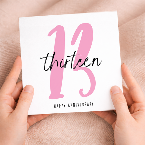 A simple and elegant 13th wedding anniversary greeting card for a husband or wife featuring a letters and numbers design on a white background.