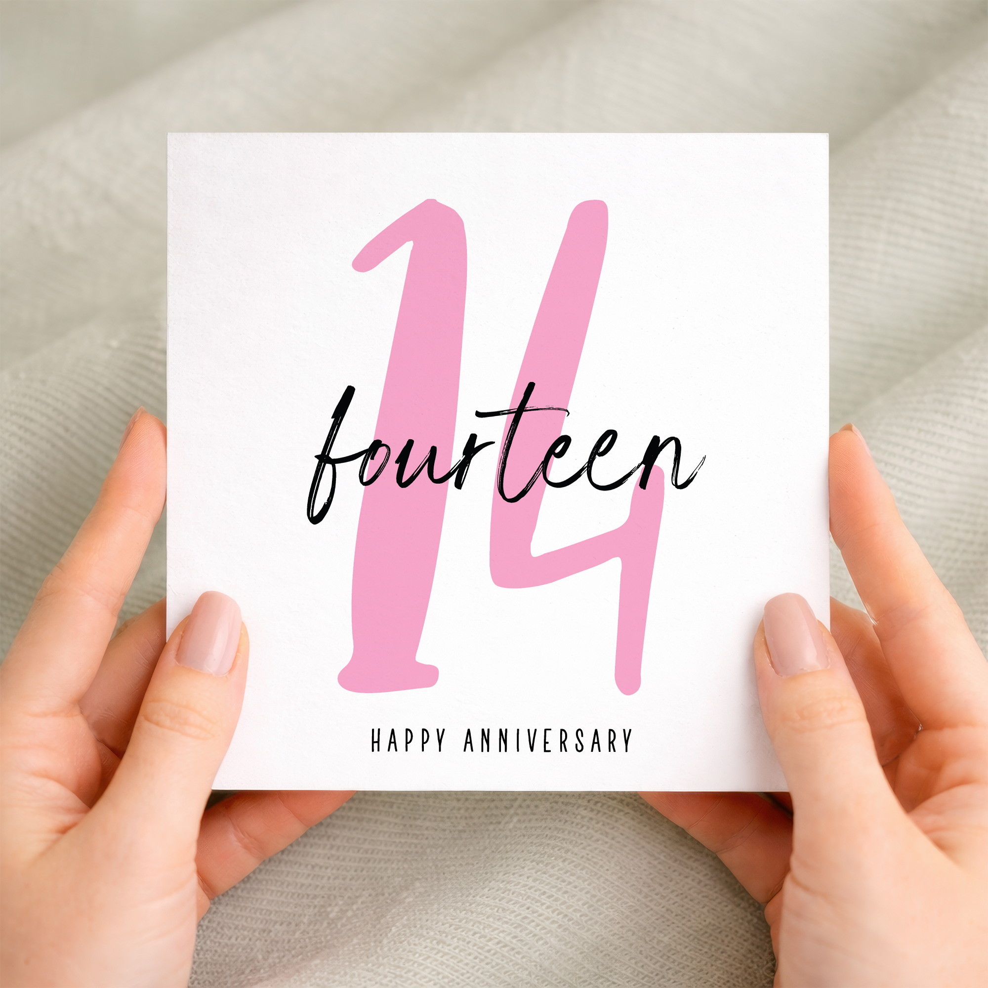 A 14th wedding anniversary greeting card featuring a simple and elegant typography design on a white background with a brown kraft envelope.