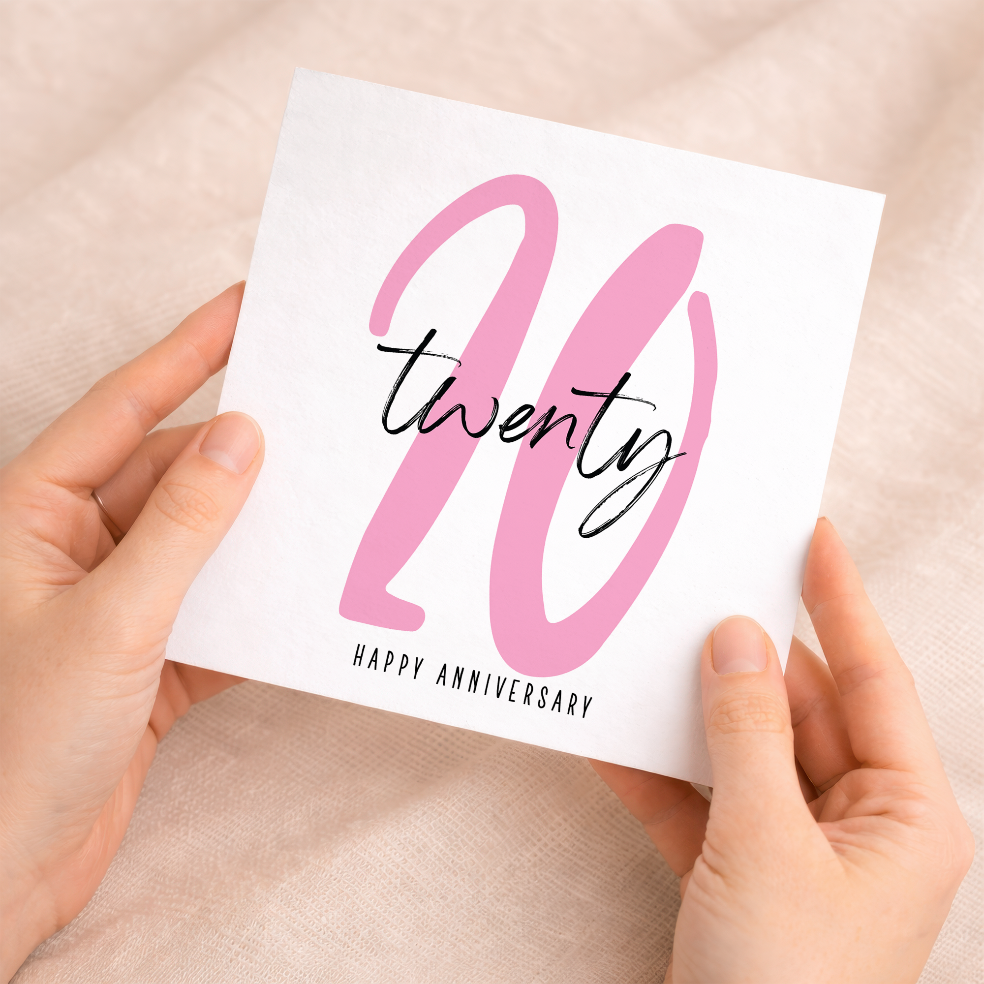 A simple and elegant 20th Wedding Anniversary greeting card featuring a number-based design on a white recycled background.