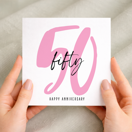 An elegant 50th wedding anniversary greeting card featuring a stylish 50 design on a white background.