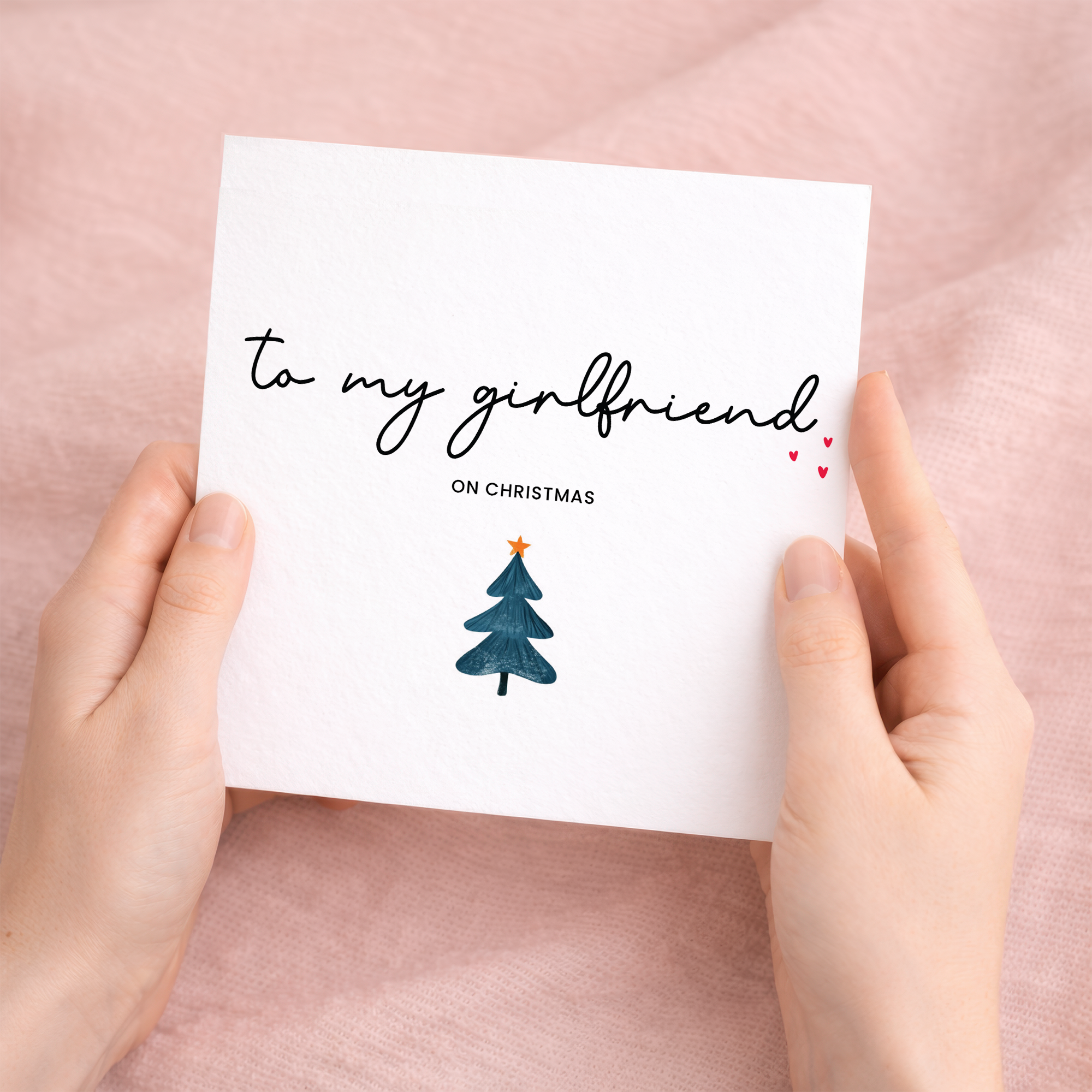 A romantic Christmas greeting card for a girlfriend celebrating their first Christmas together, featuring a stylish typographic design on a white background.
