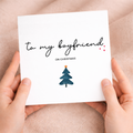 A unique and festive Christmas greeting card for a boyfriend featuring a stylish letters and numbers design on a white background.