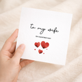 A simple and cute Valentine's Day greeting card for a wife featuring a romantic design on a white background.