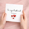 A simple and cute Valentine's Day greeting card for a husband featuring a minimalist design on a white background.
