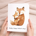 A cute illustration of a fox and cub on a Father's Day greeting card for dad.