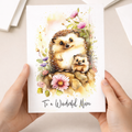 Cute hedgehog illustration on a birthday card for mum with festive decorations and soft colors.