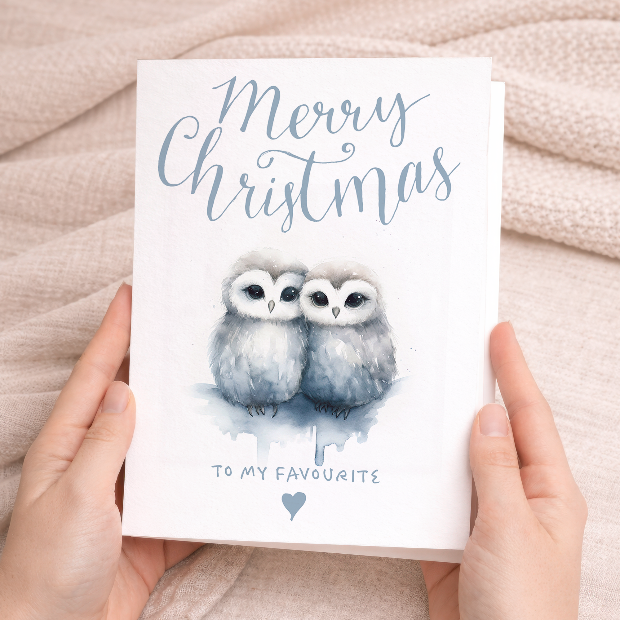 A charming Christmas card featuring two cute owls snuggling together, suitable for a partner, spouse, or loved one.