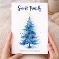 Christmas card featuring a festive green Christmas tree with a golden star on top.
