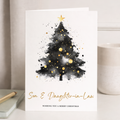 Minimalist Christmas greeting card featuring a simple green Christmas tree illustration with the message Wishing You a Merry Christmas in elegant typography.