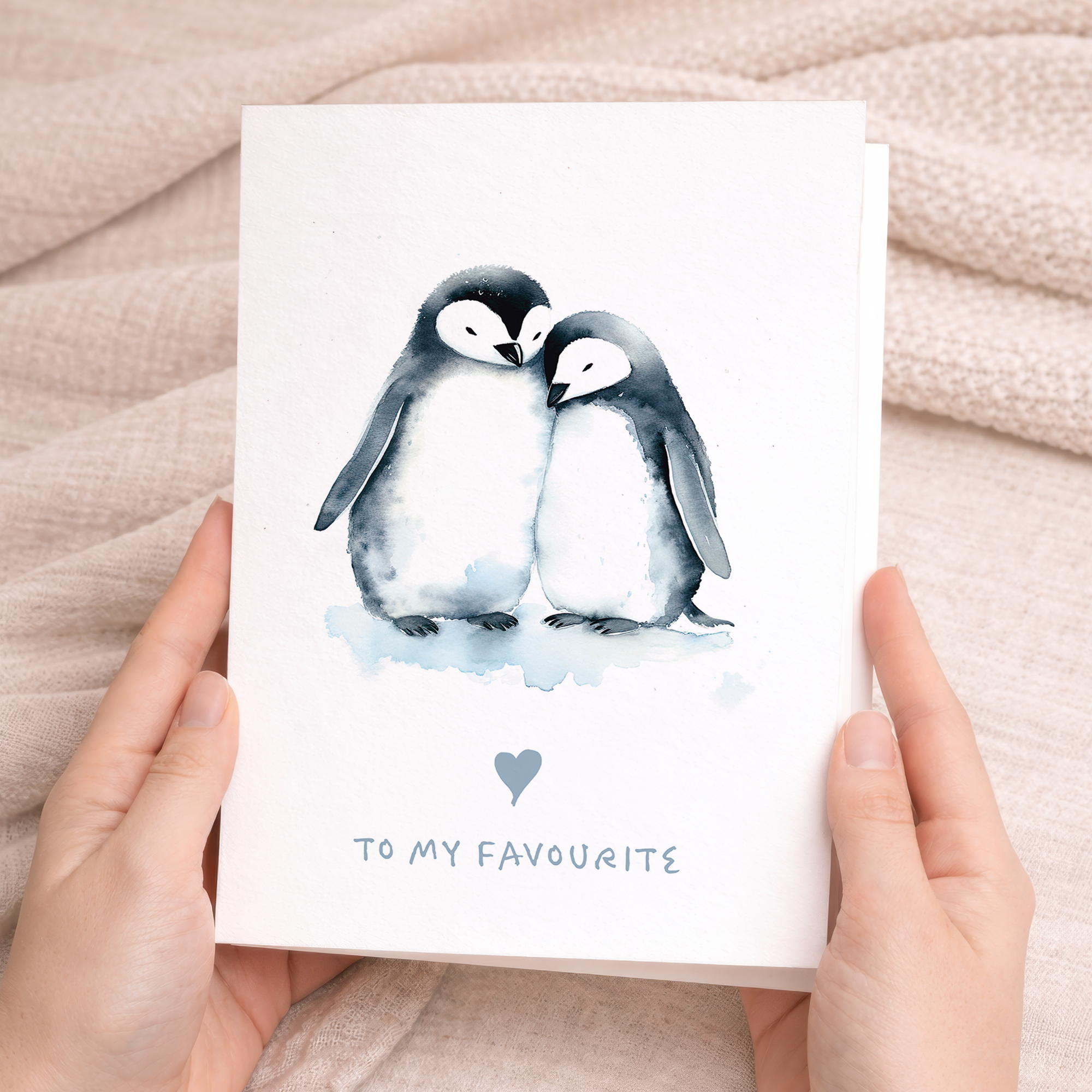 An illustration of two cute penguins standing together with a small red heart between them, on a simple white background.