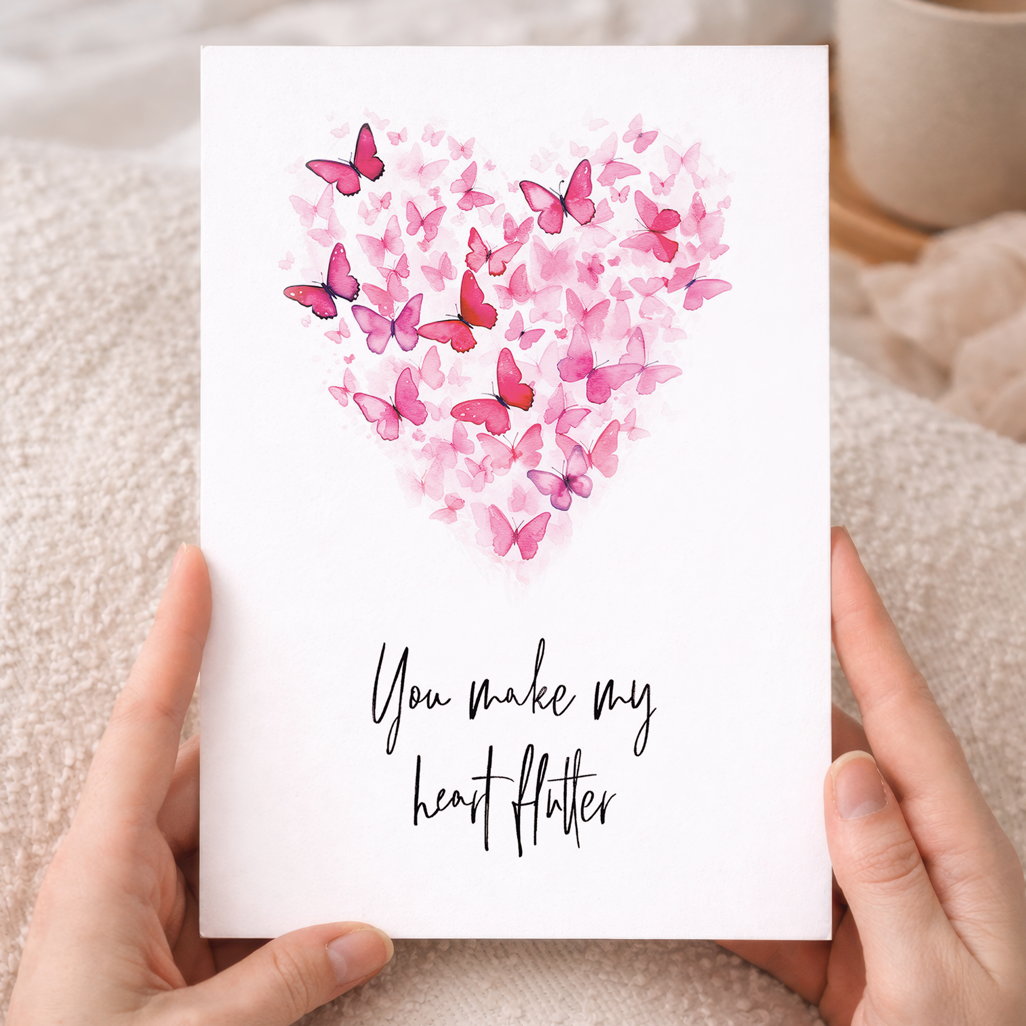 Hand-drawn illustration of a vibrant butterfly with colorful, patterned wings forming the shape of a heart, set against a clean white background with a modern and minimalist aesthetic.