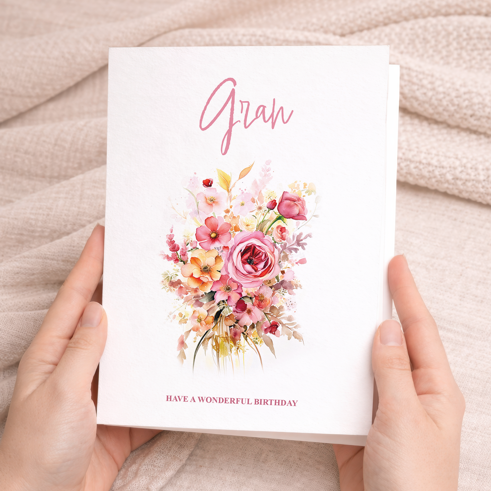 A portrait-oriented greeting card featuring a delicate pink and white floral watercolor design on a white background, with a kraft paper envelope.