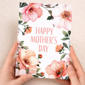 A vibrant floral Mother's Day greeting card featuring a colorful array of painted flowers and the words Happy Mother's Day written in elegant script.
