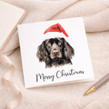 Fun Christmas Card of a Black Cocker Spaniel Dog Wearing A Santa Hat Whimsical Watercolour Christmas Card For Animal Lover For Him or Her