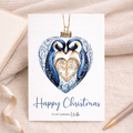 A festive Christmas card for a wife featuring a cute penguin inside a decorative bauble design.