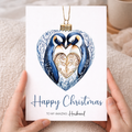 Christmas card for a husband featuring a cute penguin design inside a decorative bauble.