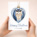 Christmas card for a couple featuring a cute penguin design inside a holiday bauble.
