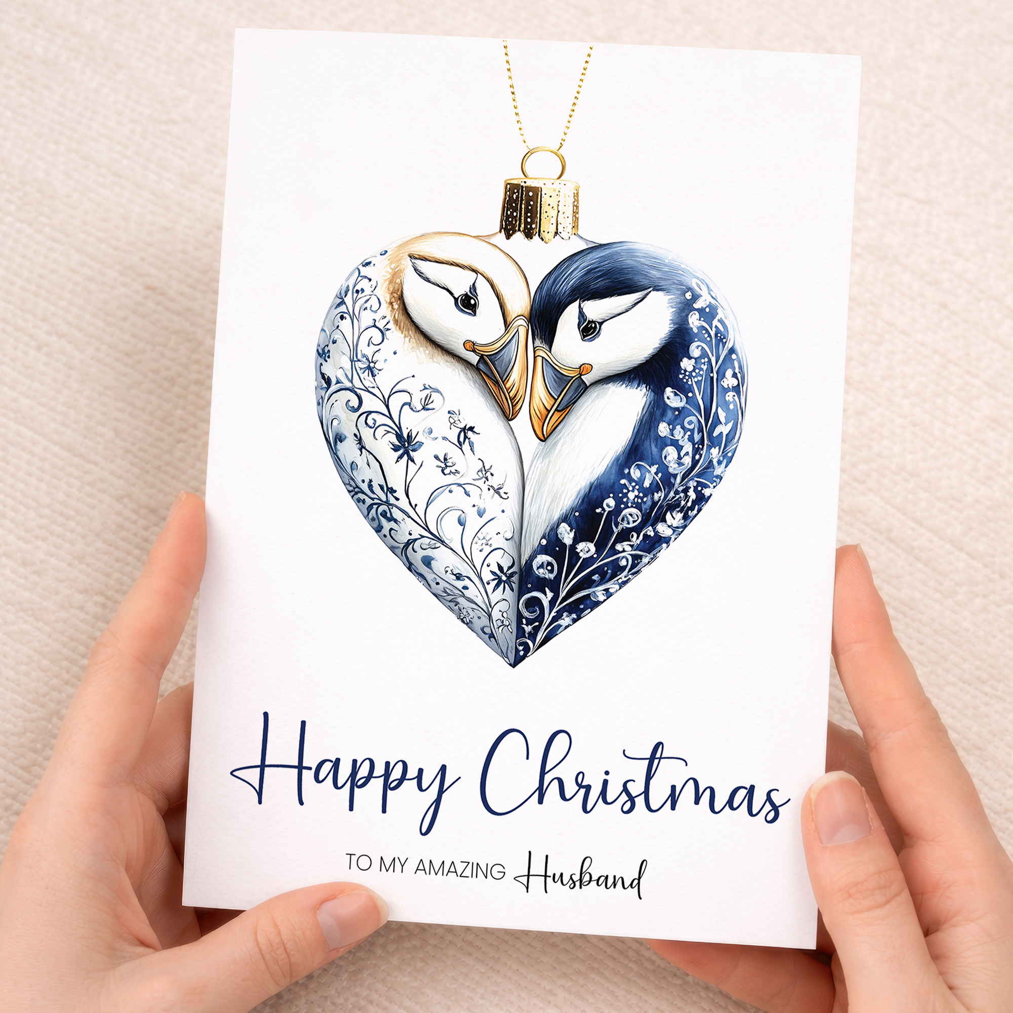 A 5x7 Christmas card featuring a unique puffin bauble design on a white background, perfect for a husband.