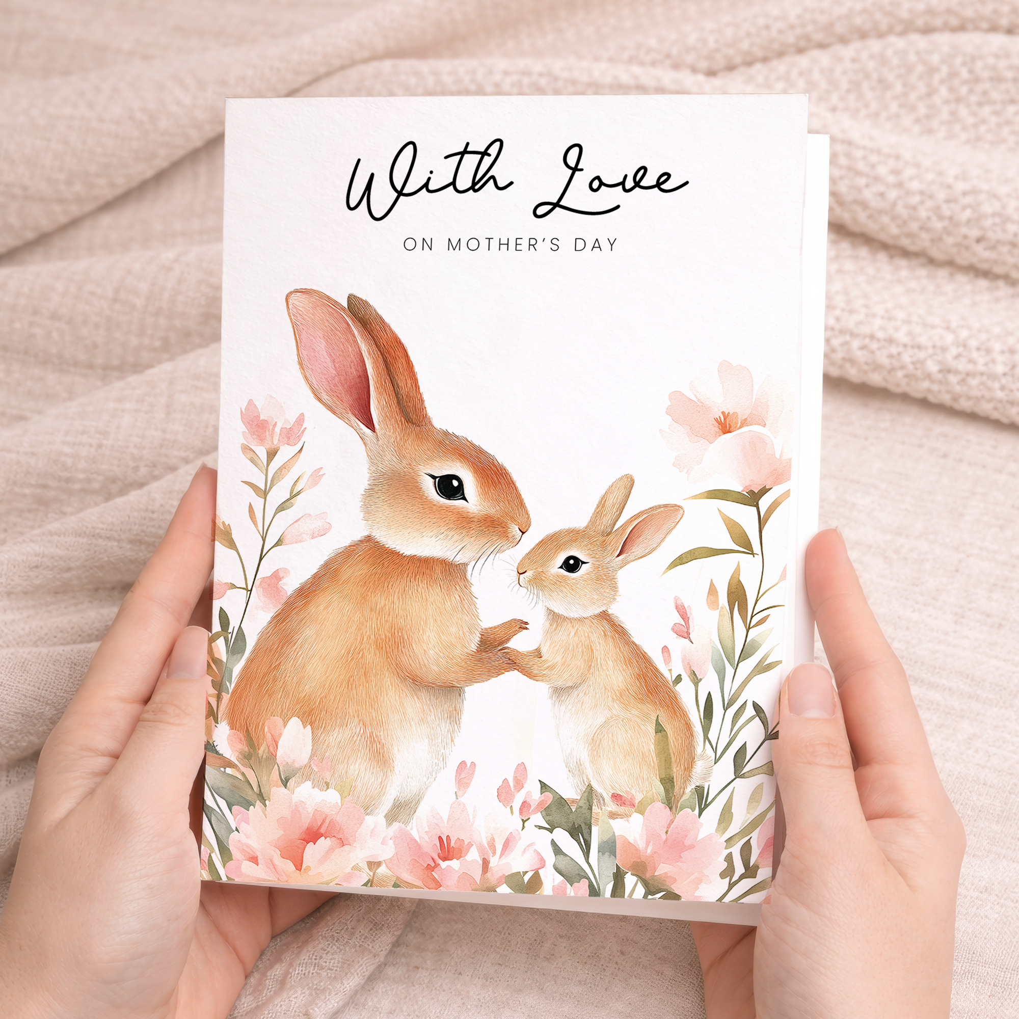 An elegant Mother's Day greeting card featuring a cute rabbit illustration surrounded by floral elements, displayed on a brown and beige background.