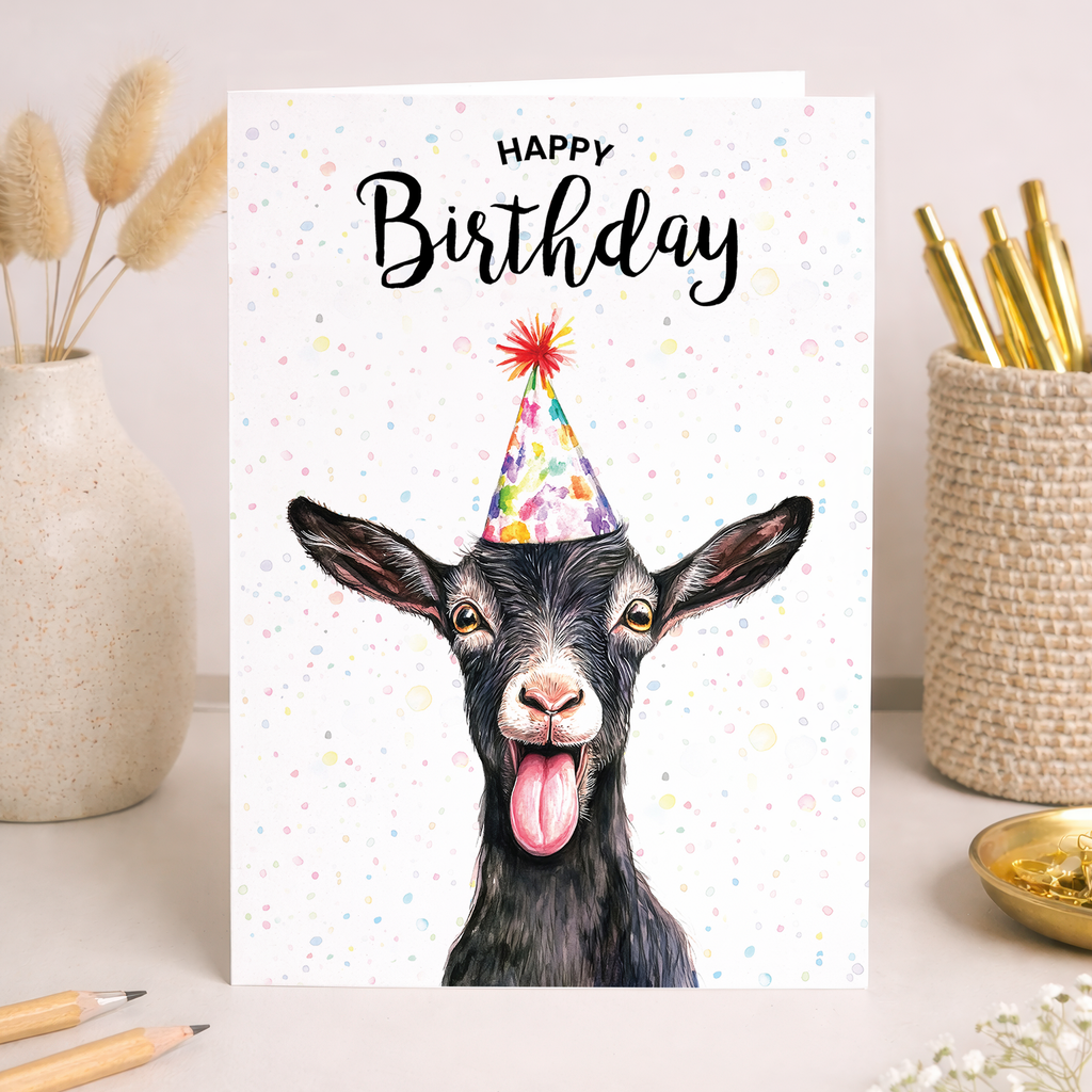 Watercolor goat illustration on a birthday greeting card.