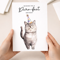 A portrait-oriented birthday card featuring an illustration of a grey British Shorthair cat wearing a colorful party hat, set against a plain background with the message "Wishing You a Purr-fect Birthday."