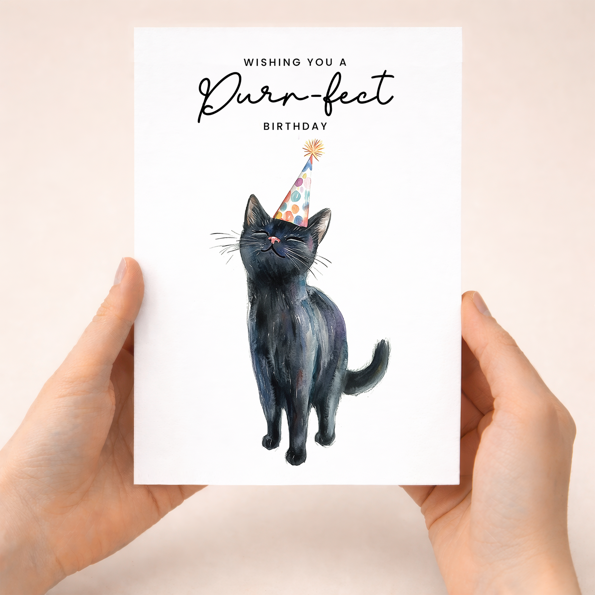 A cute illustration of a black cat wearing a colorful party hat on a white birthday greeting card.