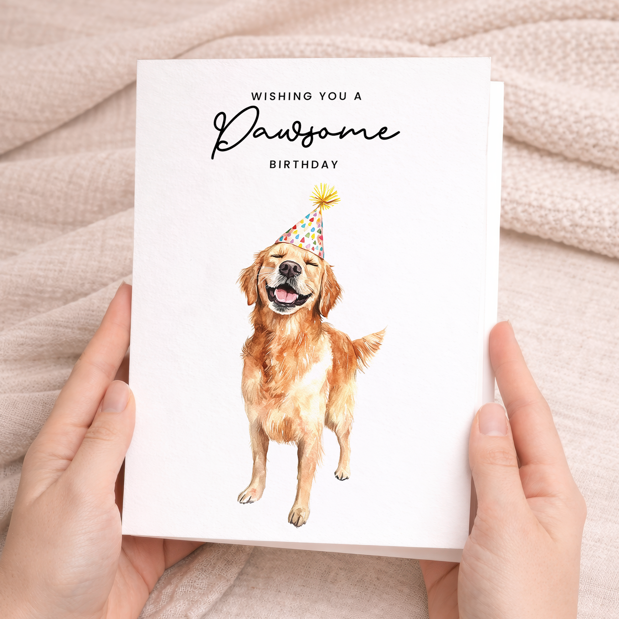 A Golden Retriever dog wearing a colorful, patterned party hat on a white background with the text Wishing You a Pawsome Birthday.