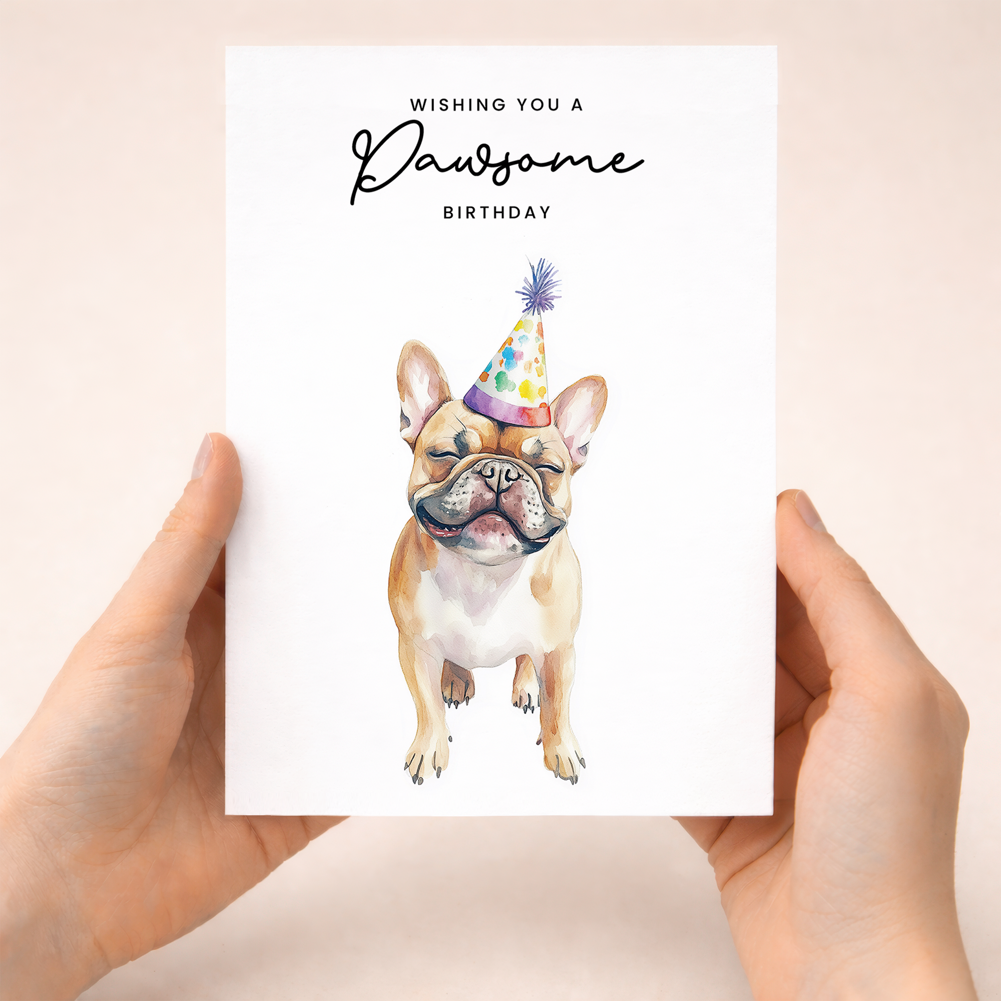 A cute French Bulldog wearing a colorful party hat on a birthday greeting card for dog lovers.