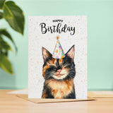 A birthday card featuring a charming tortoiseshell cat illustration, perfect as a gift for him or her.